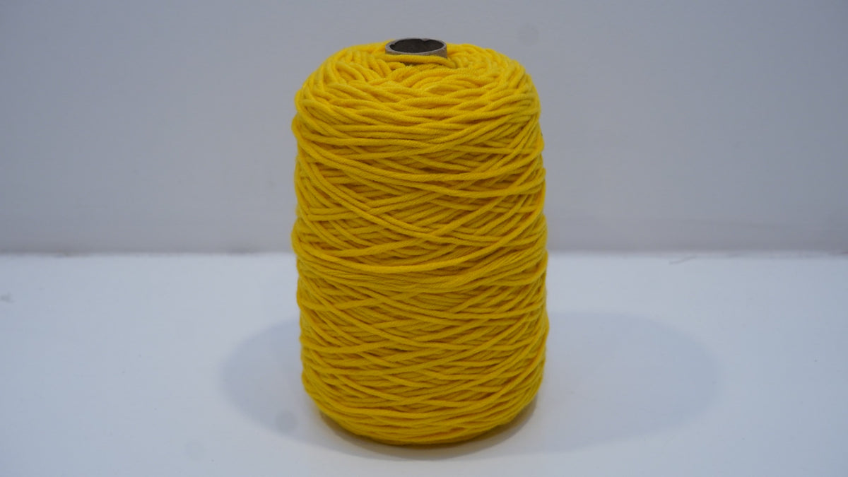 Golden yellow tufting yarn single skein front view