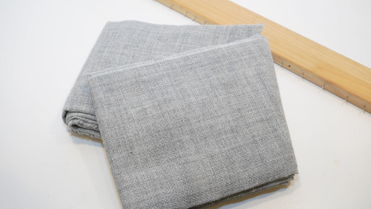 Folded grey premium tufting cloth for rug making
