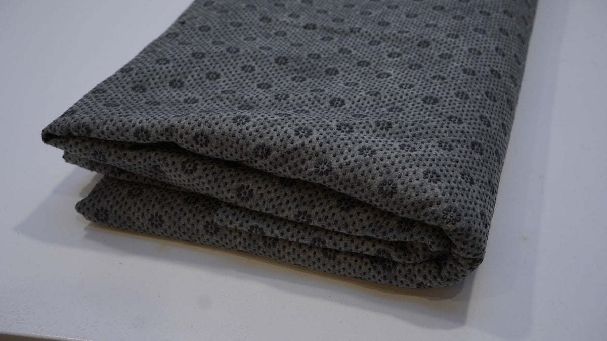 Black rug backing cloth, folded close-up