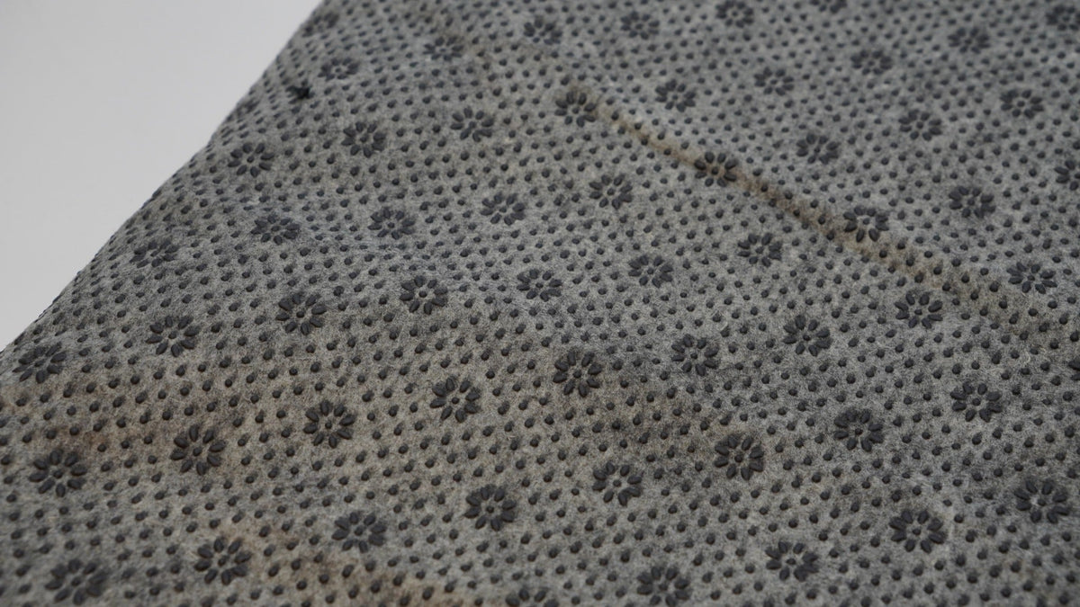Grey rug backing cloth with anti-slip grip pattern