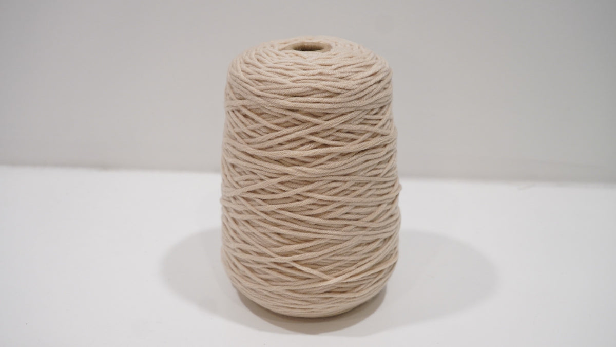 Warm beige tufting yarn single skein front view