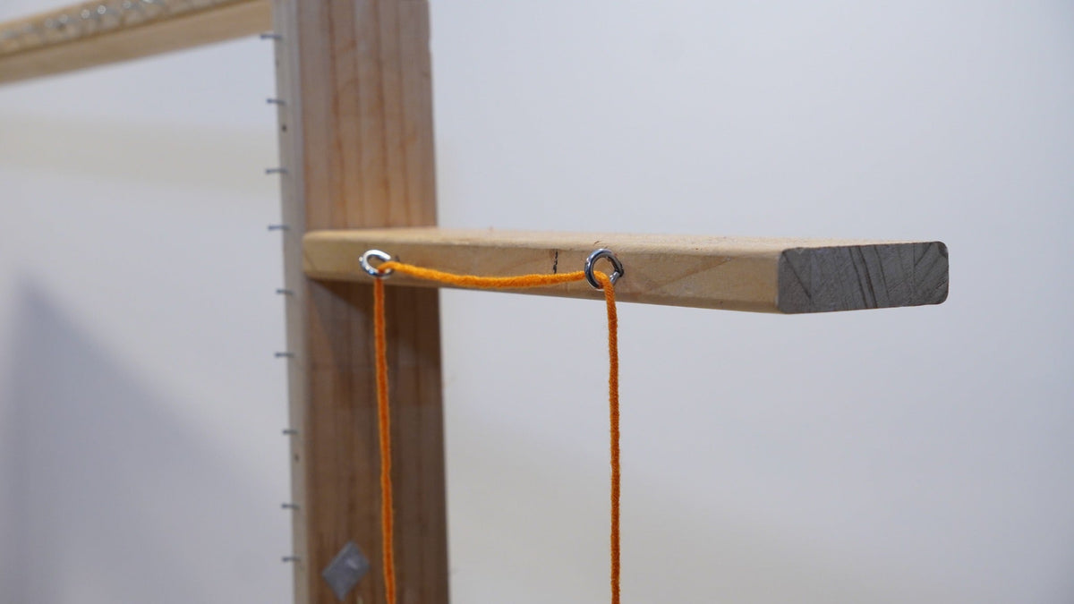 Upper thread guide eyelets on the adjustable wooden tufting frame